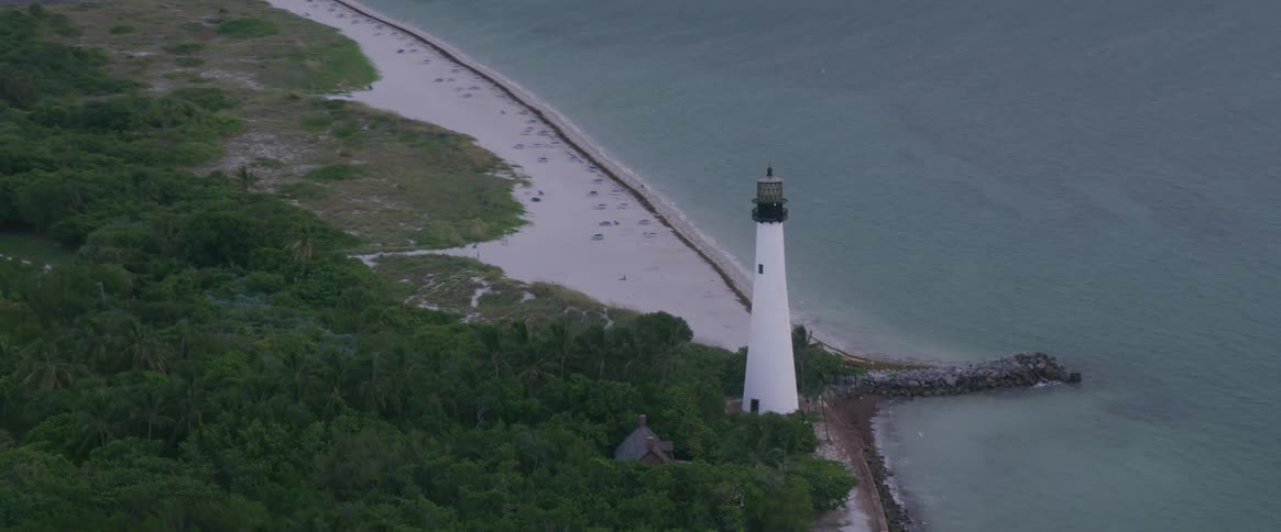 Aerial view of a lighthouse along a shoreline