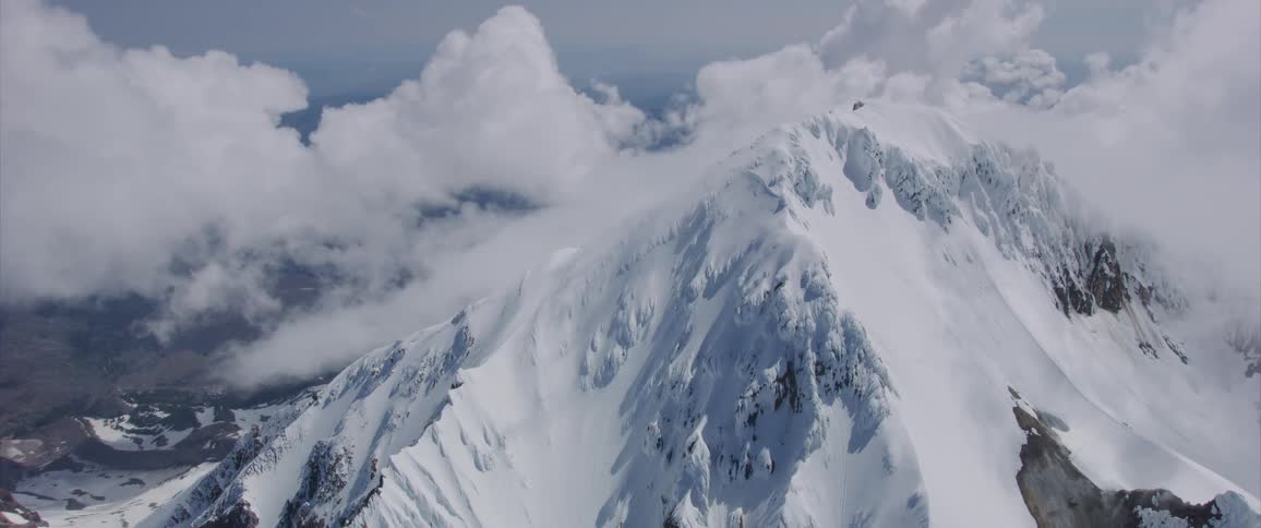 Snow is covering the mountaintops