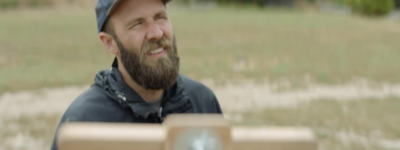 A man looks at his painting
