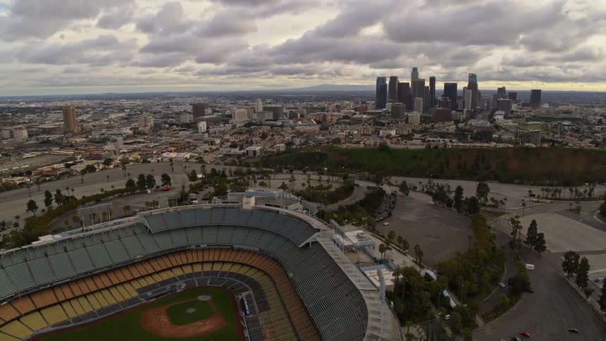 Aerial view of baseball stadium and a city skyline