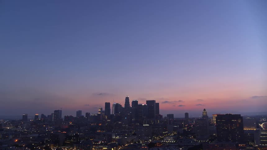 Aerial view of a metropolitan area at sunset