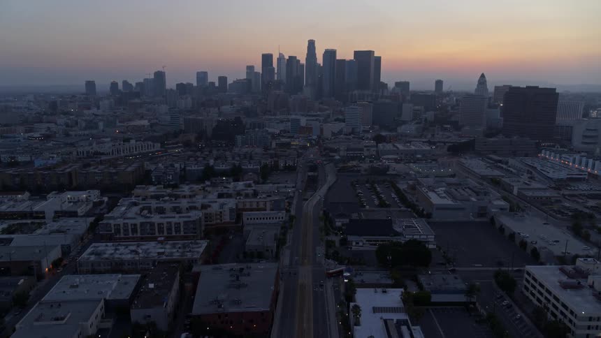 Aerial view of city skyline at sunrise
