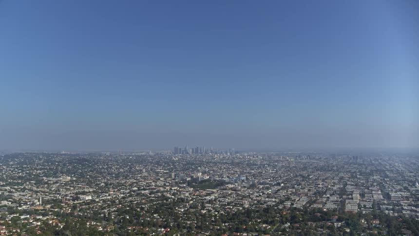 Skyline of the immense city with skyscrapers on the horizon on a cloudless sunny day