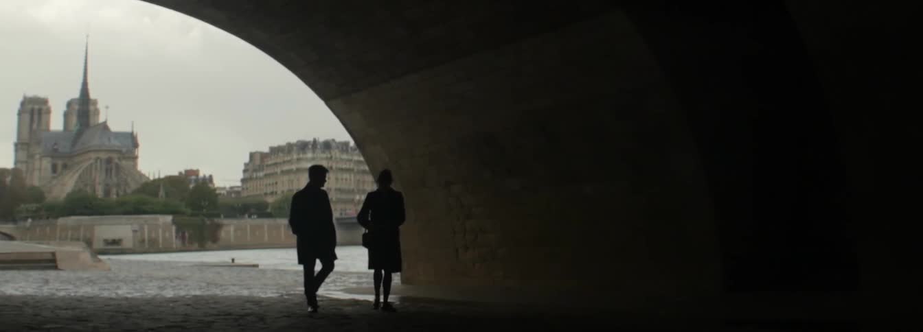 Two people speaking and traveling through a tunnel