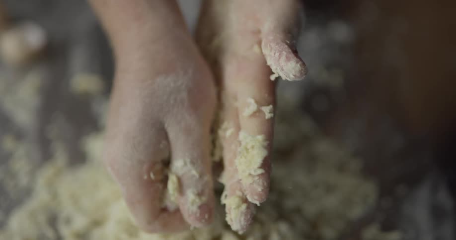 A person kneading dough