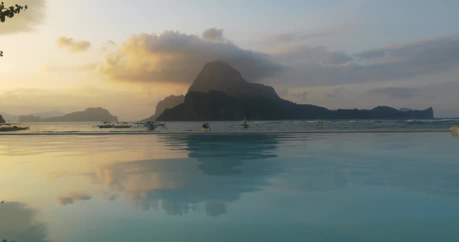 An island is shown amidst the clouds
