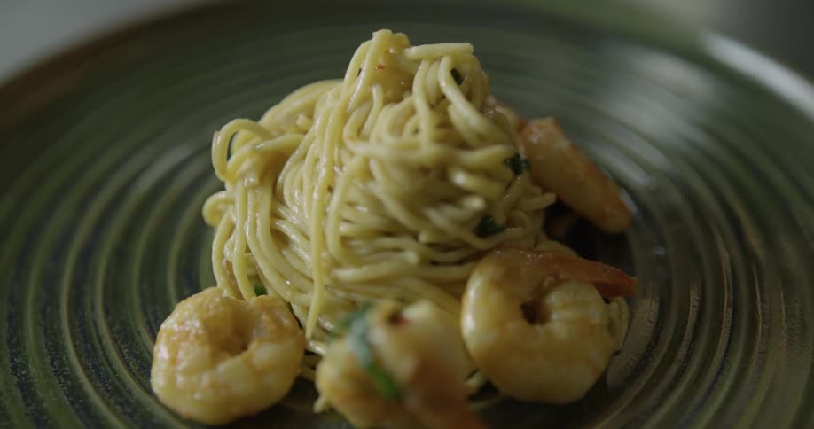 Pasta and shrimp on a artistic plate