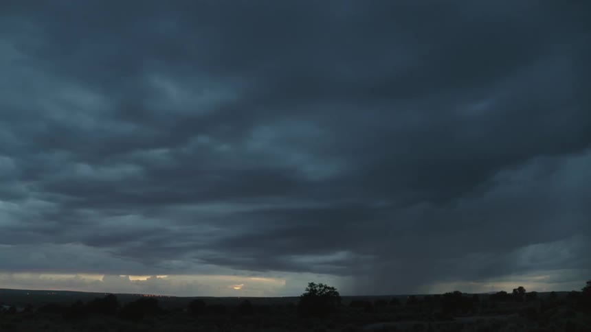 A dark sky with lightning flashes