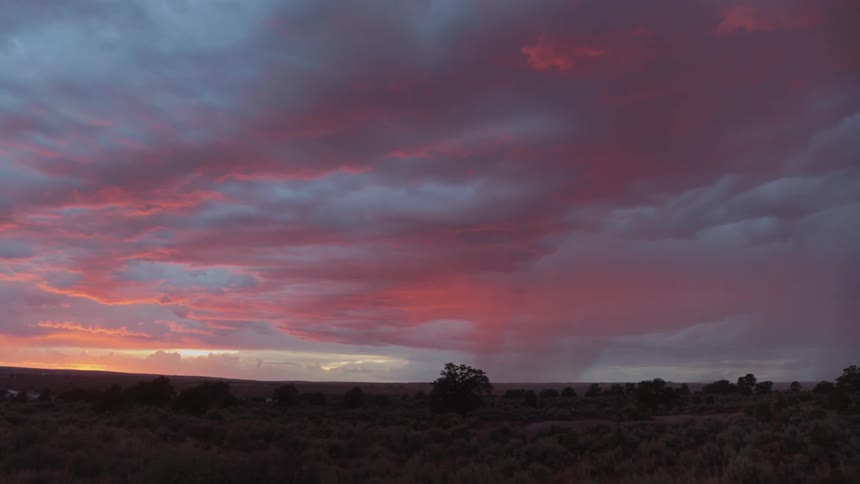 The camera looks out towards clouds and sunset colors
