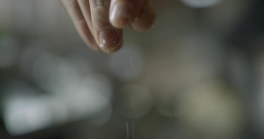 A person sprinkles salt