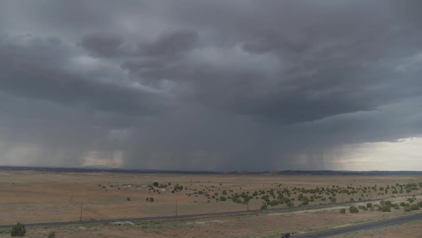 Aerial view rain storm and lightning over a rural area