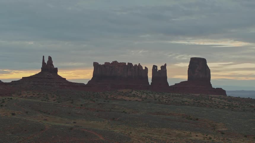 A desert with peaks and the sky in the background