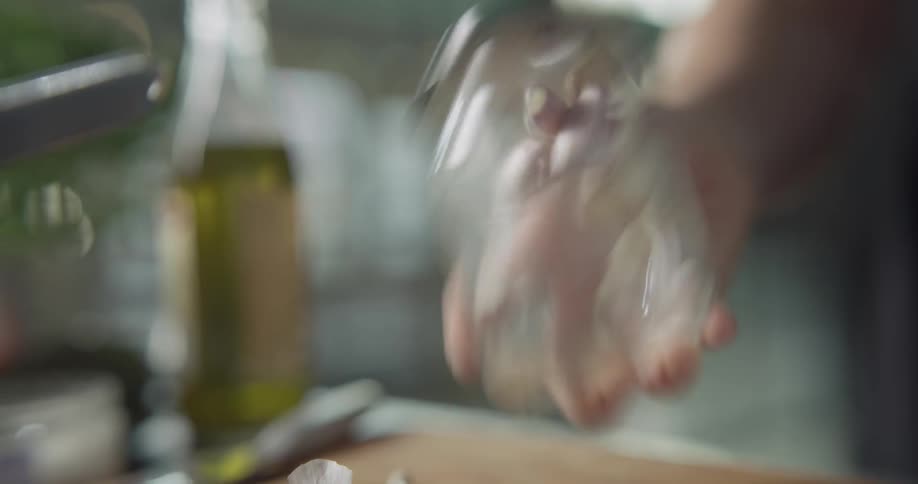 Someone is shaking small glass jar in their hand