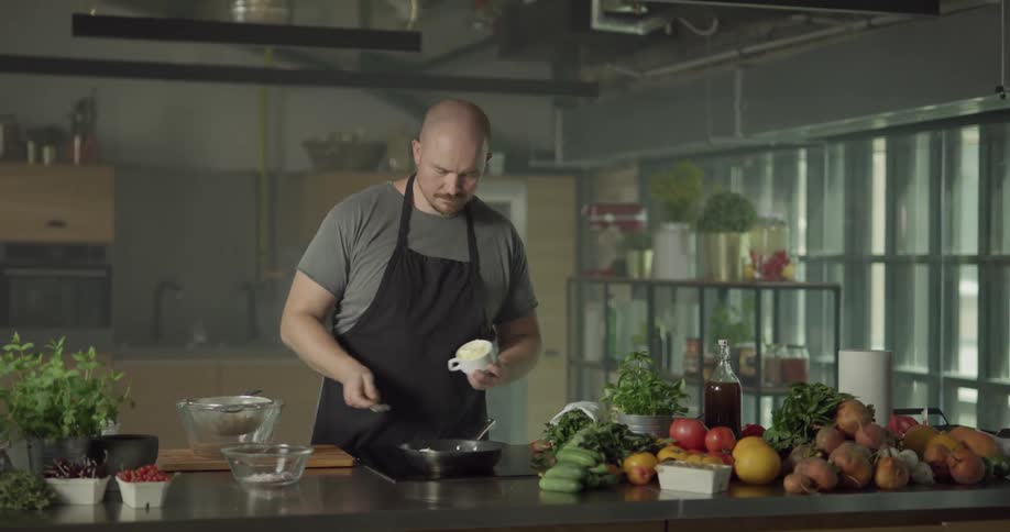 A person cooking on a stovetop