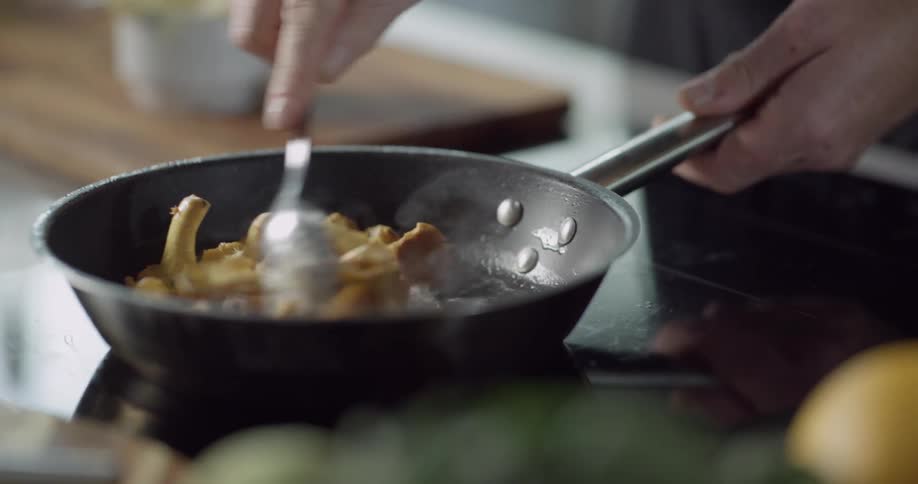 Food is poured into a hot pan