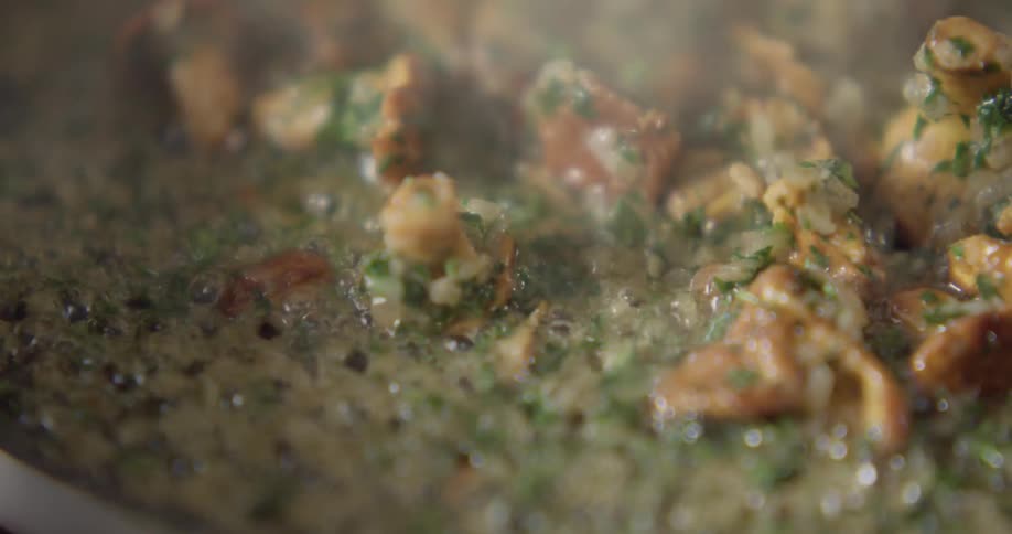 The camera looks at cooking food