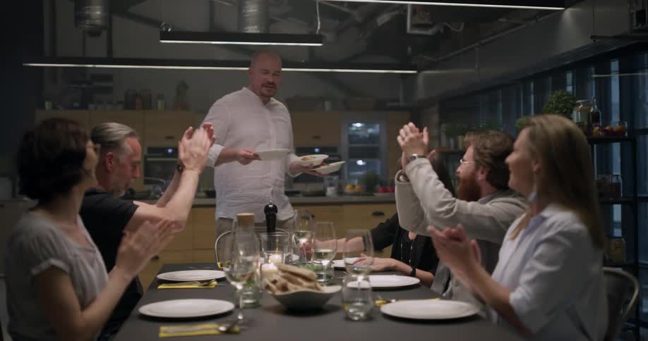 A group of people sitting at a dining table