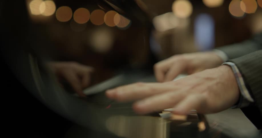 A man plays a piano