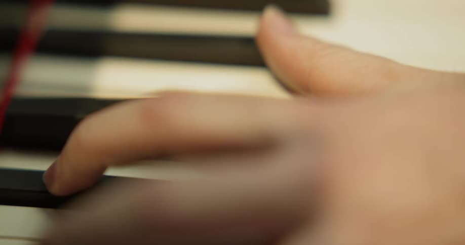 Person plays piano