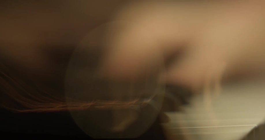 A person plays a piano