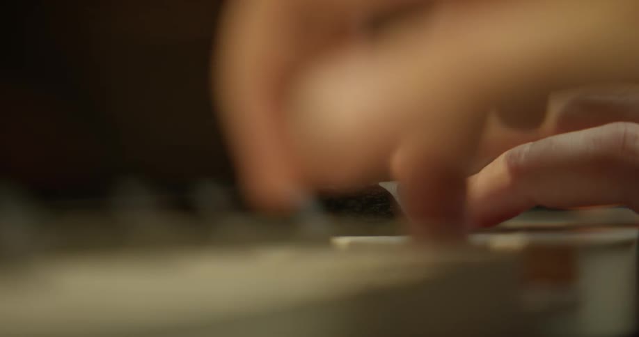 A person plays a piano