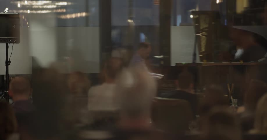 A man playing piano in a restaurant