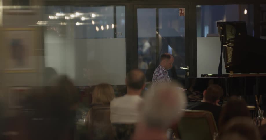 A man playing a small piano concert