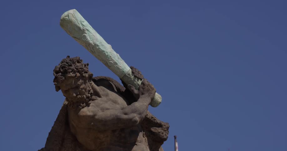 The fighter statue in front of the prague castle on a blue sky sunny day