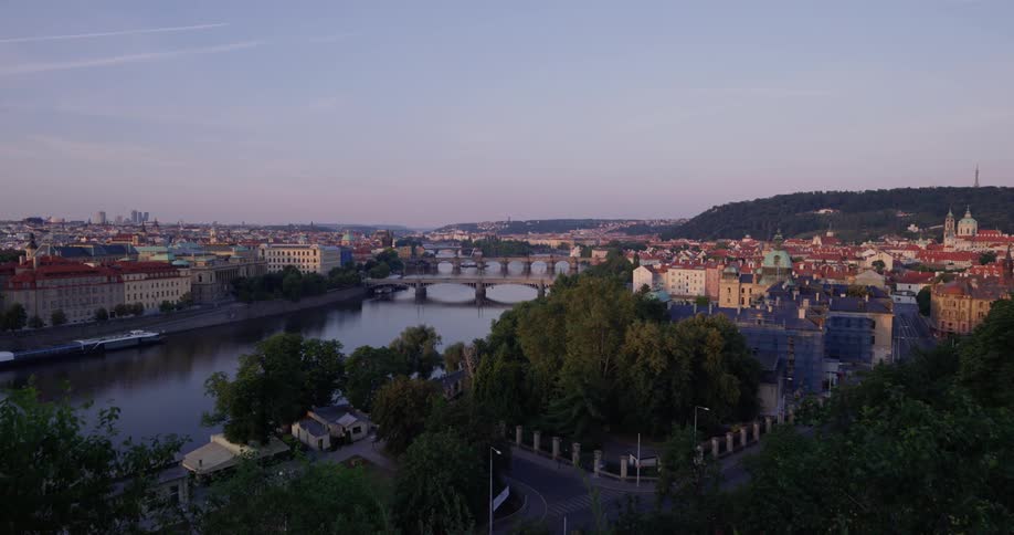 The bridge gaps the river in the city below