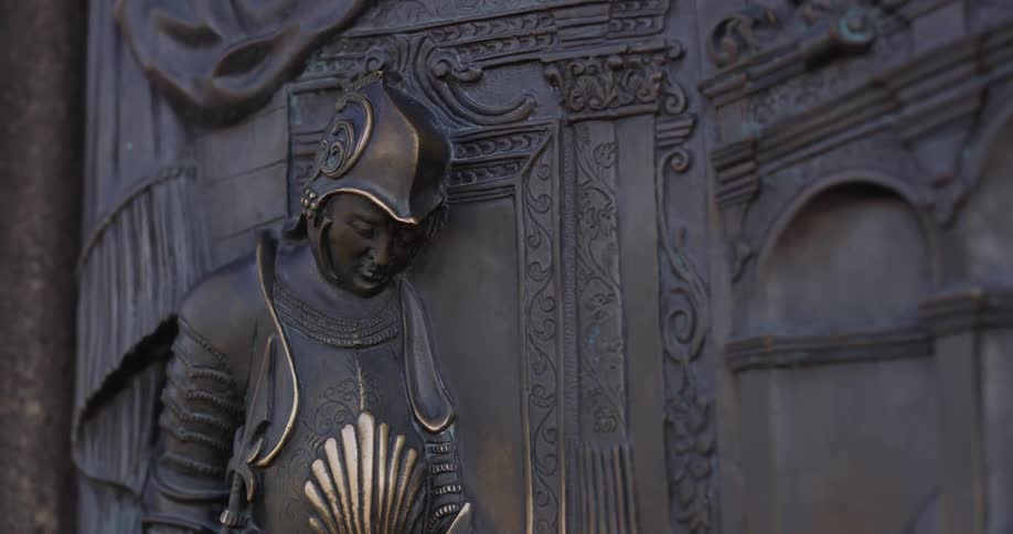 The side of the wall has a statue of a man