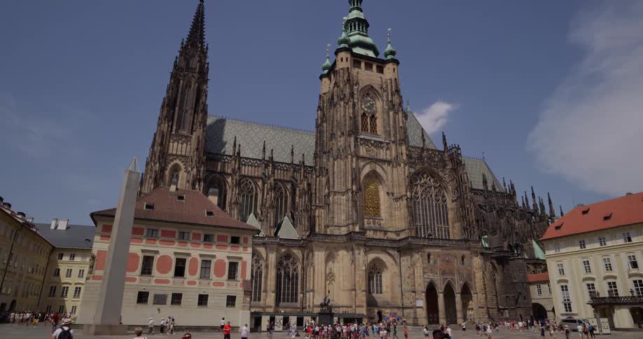Gothic architecture with spires and newer buildings surrounding walkways