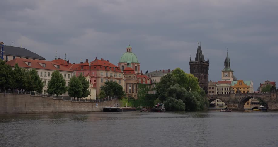 Ornate buildings border water and bridges
