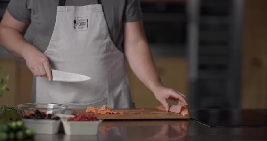 A man is slicing meat