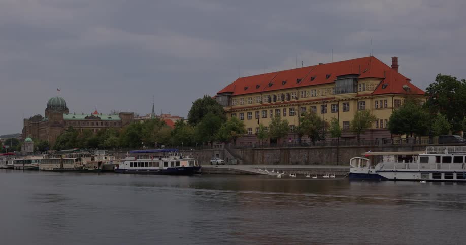 Buildings near river and docked riverboats