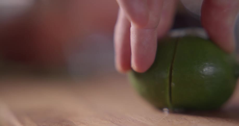A lime is sliced in half