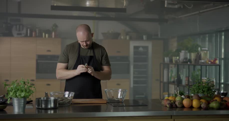 A man peels a food item