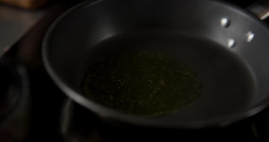 Oil is poured on a pan