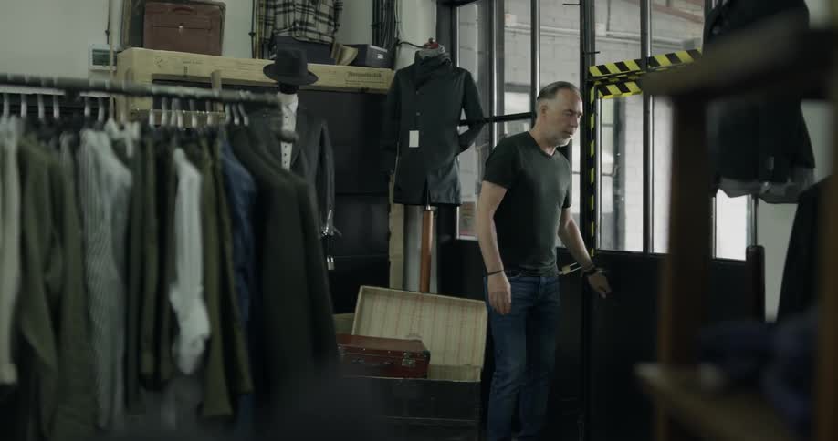 A man walks into a clothing store