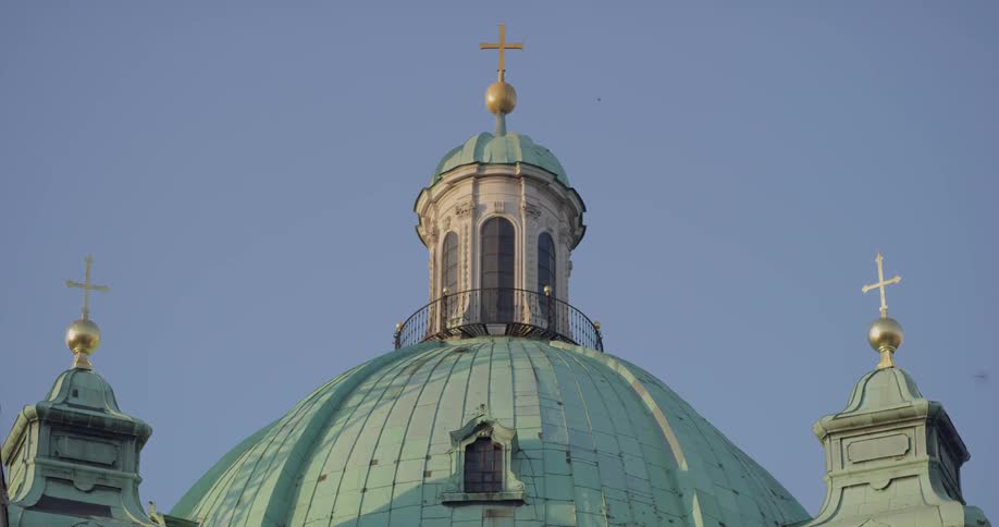 The church roof has a cross at the top
