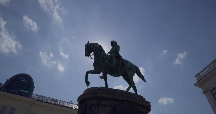 A statue of a man on a horse during the day