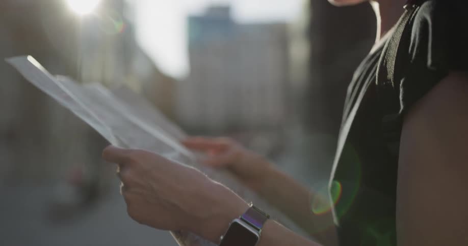 A woman looks at a map