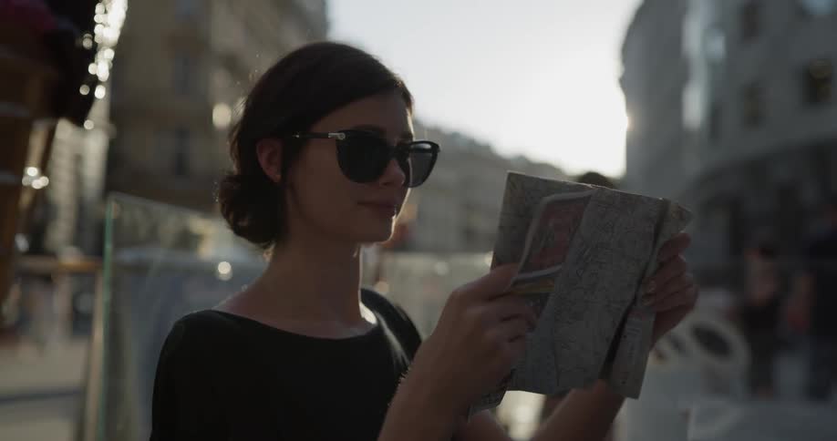 A woman reads a magazine outside