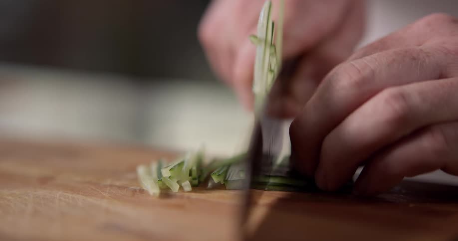 A man slices vegetables