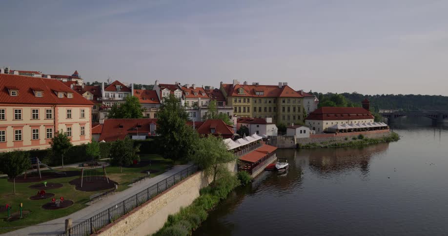 A town on a riverbank during the day