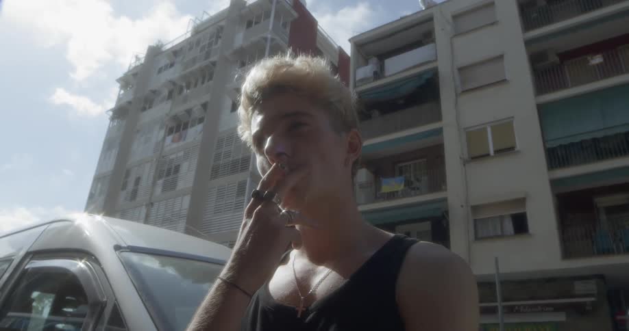 A teenage boy smoking a cigarette