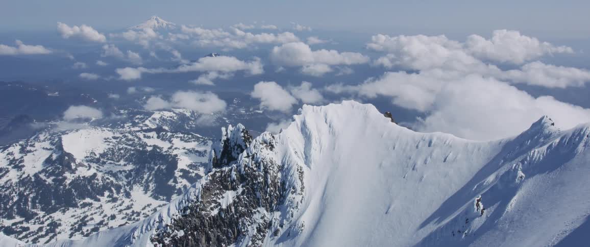 Aerial view of a mountain range covered in snow