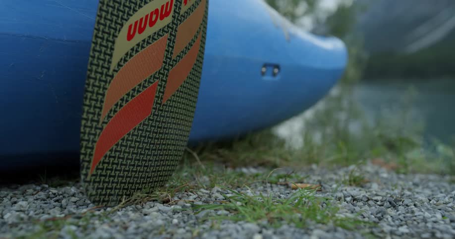 Kayak being pushed towards water