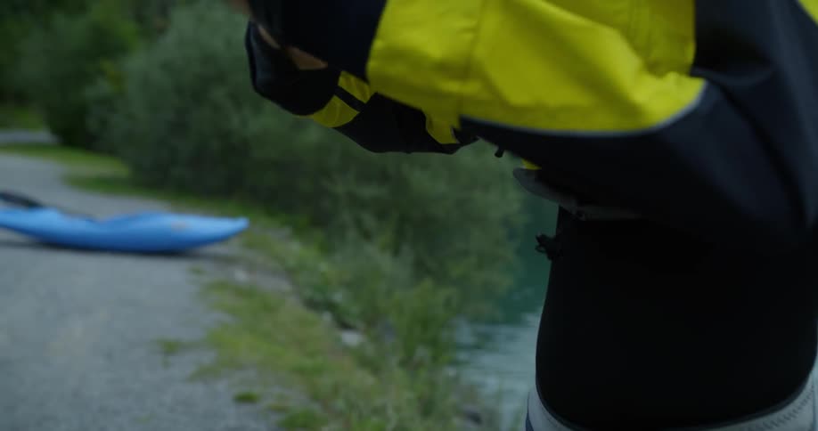 A person pulls a jacket over their head