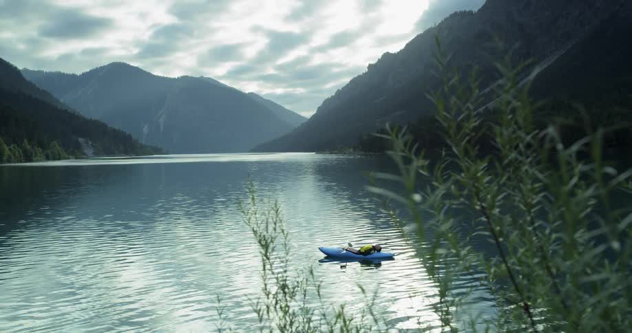 A serene view of a lake embedded within mountains