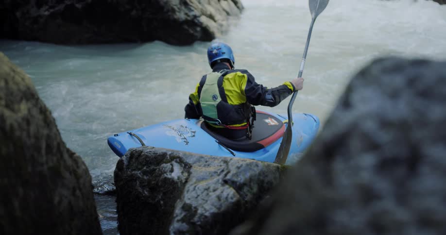 A man is about to boat through some rapids